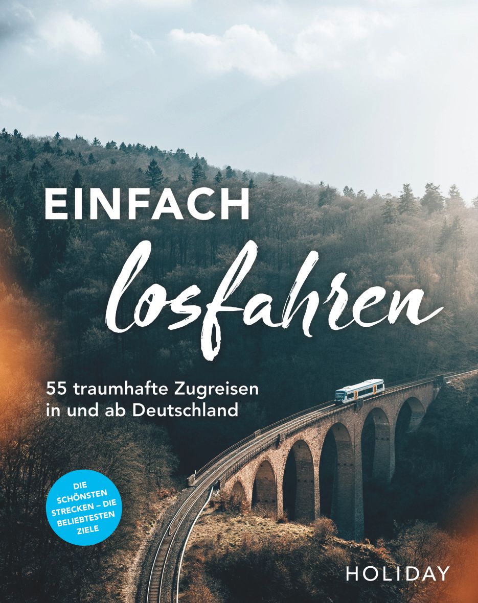 9783834233141 HOLIDAY Reisebuch: Einfach losfahren, Traumhafte Zugfahrten, alte Zugbrücke in malerischer Landschaft auf dem Titel