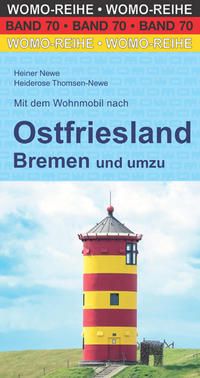 OstfrieslandtUhkZUTerjjZW Mit dem Wohnmobil nach Ostfriesland, Gestreifter Leuchtturm im Fokus