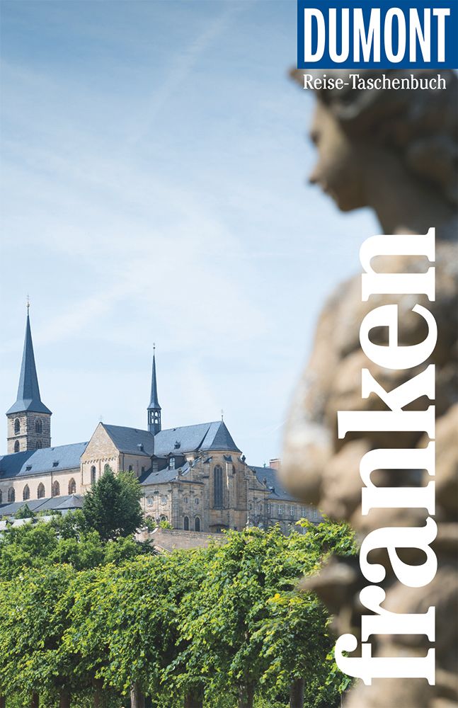 9783616021362 DuMont Reise-Taschenbuch Franken, Fokussiert auf ein Schloss mit einer Statue im Vordergrund